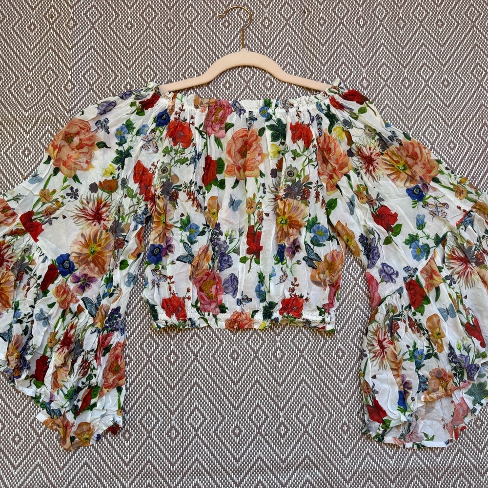 Vici Off-Shoulder Floral Crop Top in White with Red, Orange, Purple Accents